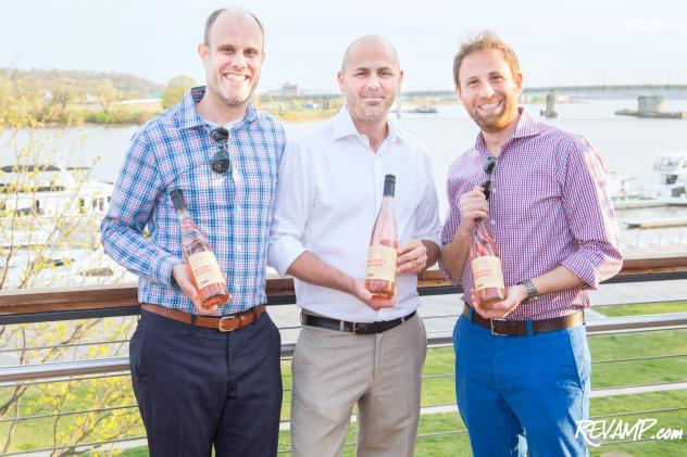 District Winery co-founders John Stires (left) and Brian Leventhal (right) flank company winemaker Conor McCormack.